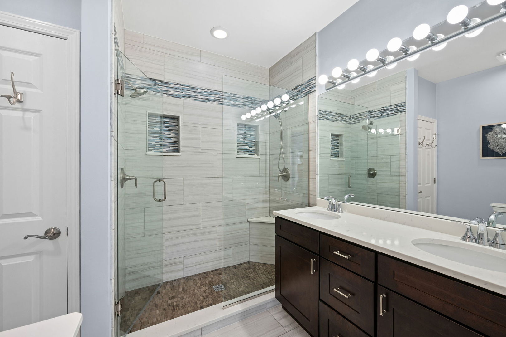 813 West University Lane Chicago, IL 60608 - Photo 20 of 33 a bathroom with a double vanity sink mirror and shower