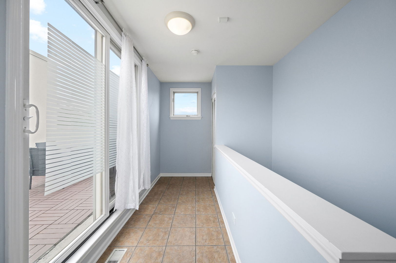 813 West University Lane Chicago, IL 60608 - Photo 24 of 33 a view of a hallway with wooden floor and staircase
