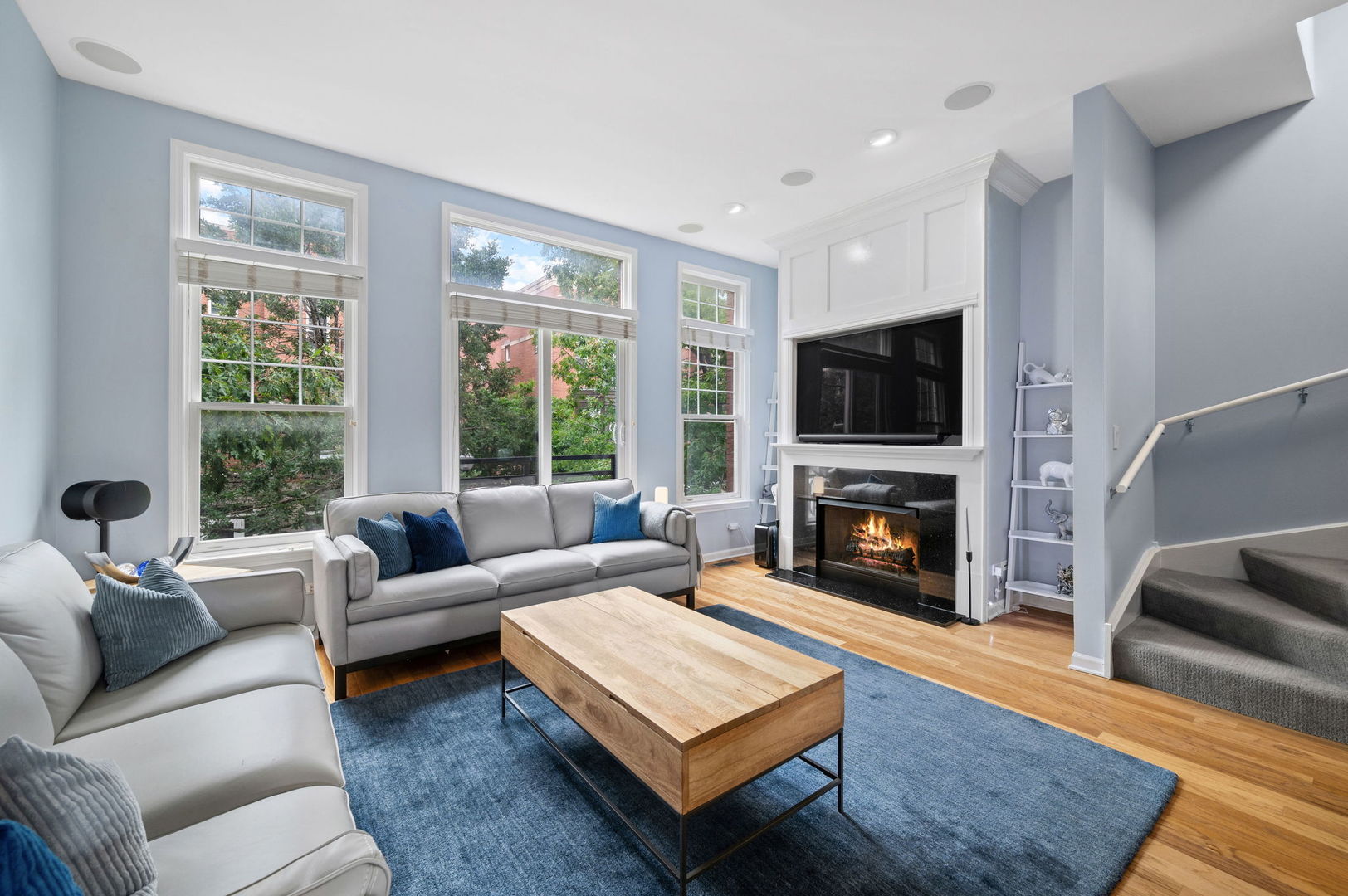813 West University Lane Chicago, IL 60608 - Photo 9 of 33 a living room with furniture a fireplace and a flat screen tv