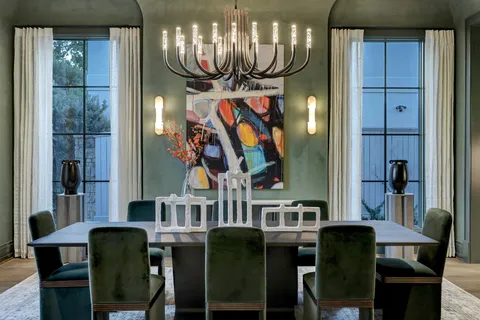 a dining room with furniture and chandelier
