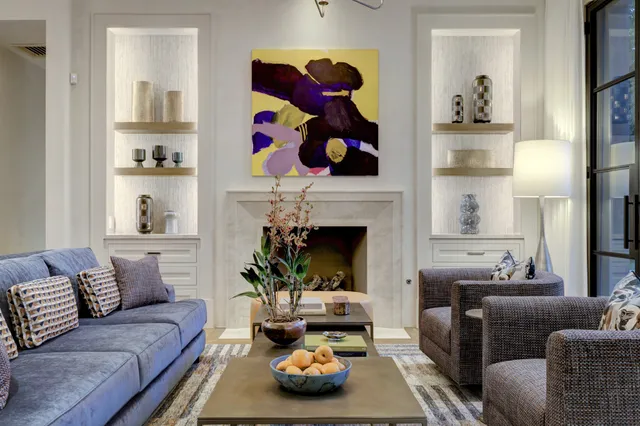 a living room with furniture and a fireplace