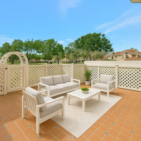 a view of a patio with couches table and chairs and potted plants