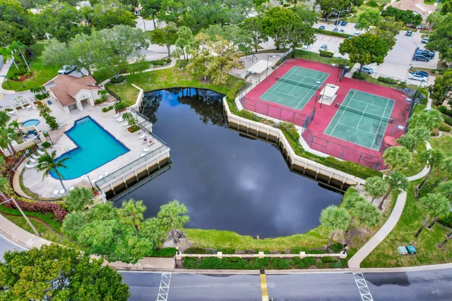 an aerial view of a house a yard and outdoor seating