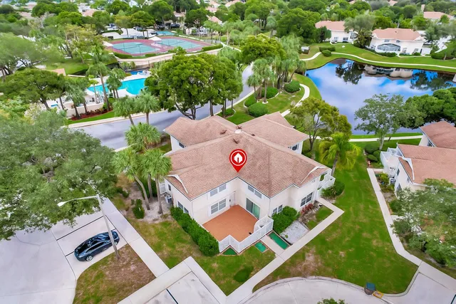 an aerial view of a house with a garden