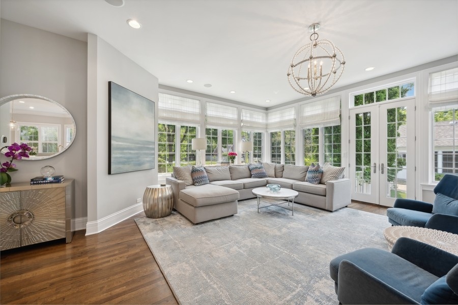 502 Willow Road Winnetka, IL 60093 - Photo 17 of 37 a living room with furniture chandelier and a large window