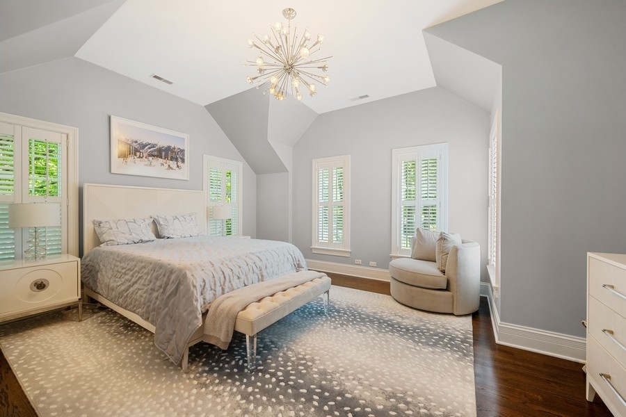 502 Willow Road Winnetka, IL 60093 - Photo 27 of 37 a bed room with a bed and a couch
