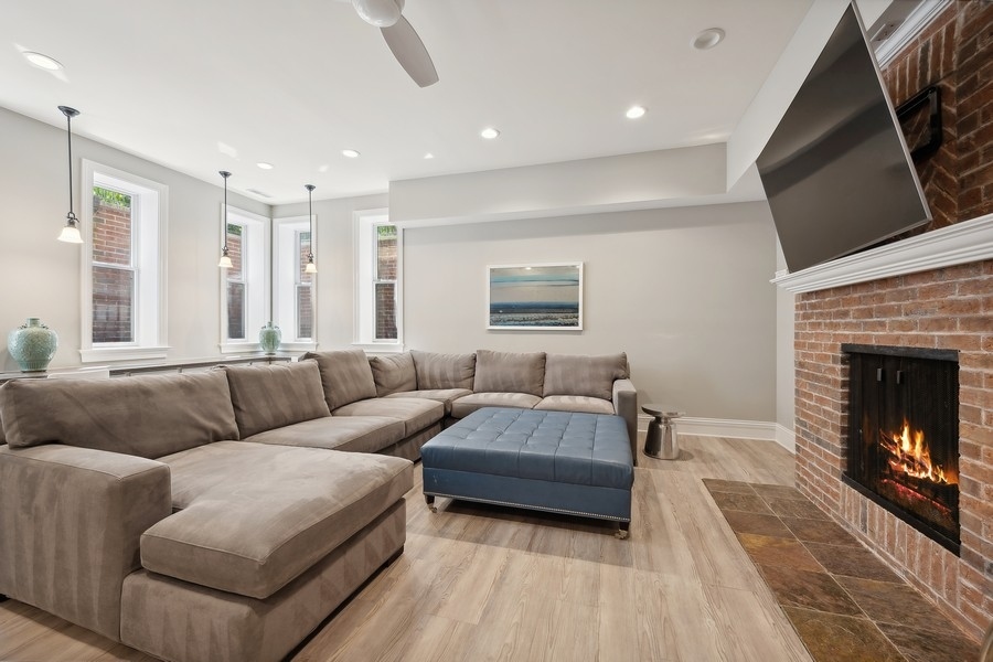 502 Willow Road Winnetka, IL 60093 - Photo 29 of 37 a living room with furniture and a fireplace