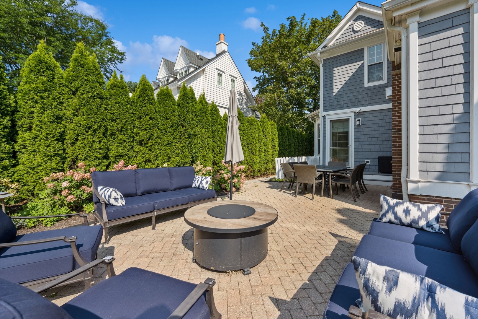 502 Willow Road Winnetka, IL 60093 - Photo 32 of 37 a view of a patio with couches chairs and a potted plant
