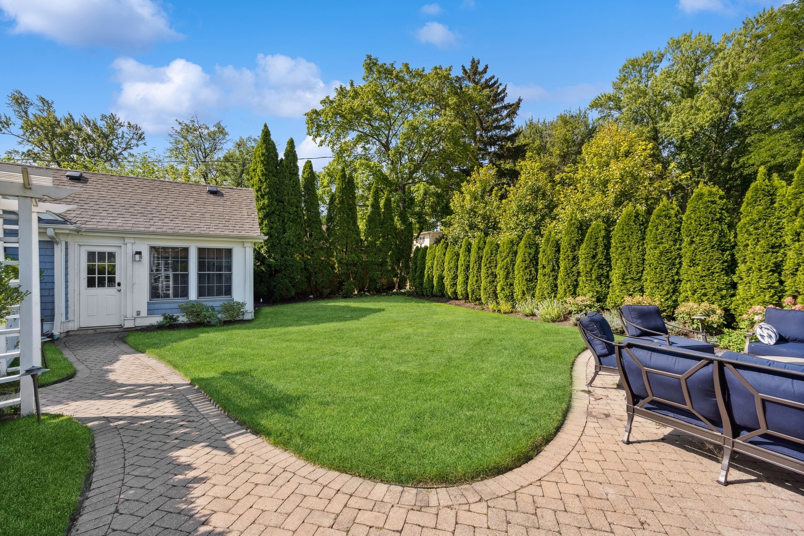 502 Willow Road Winnetka, IL 60093 - Photo 35 of 37 front view of a house with a garden