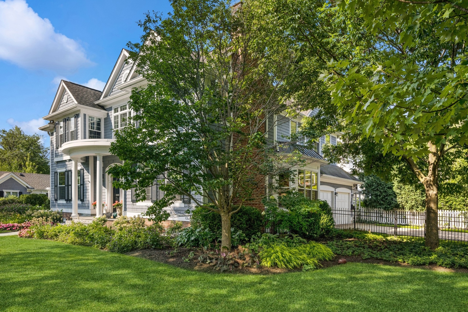 502 Willow Road Winnetka, IL 60093 - Photo 37 of 37 a front view of a house with a garden