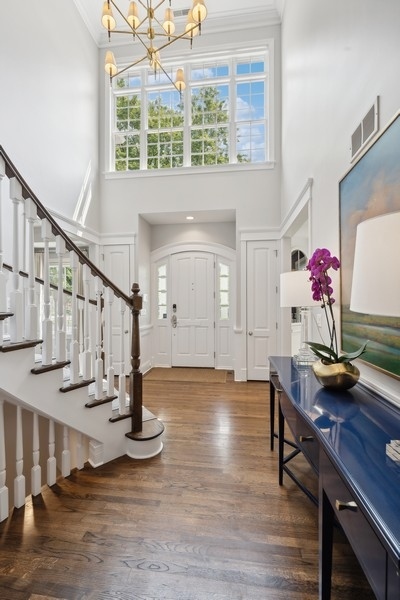 502 Willow Road Winnetka, IL 60093 - Photo 5 of 37 a view of entryway and hall with wooden floor