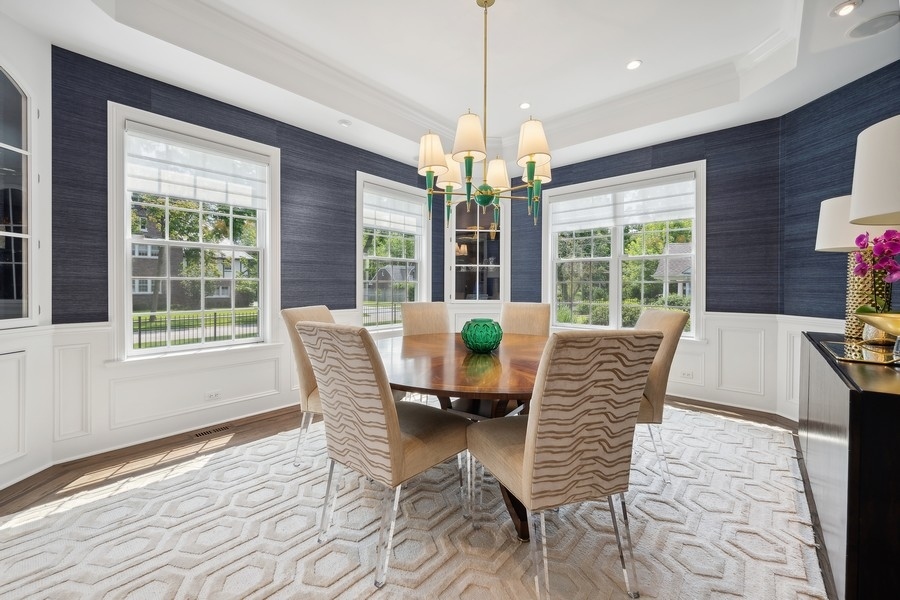 502 Willow Road Winnetka, IL 60093 - Photo 7 of 37 a dining room with furniture a chandelier and wooden floor
