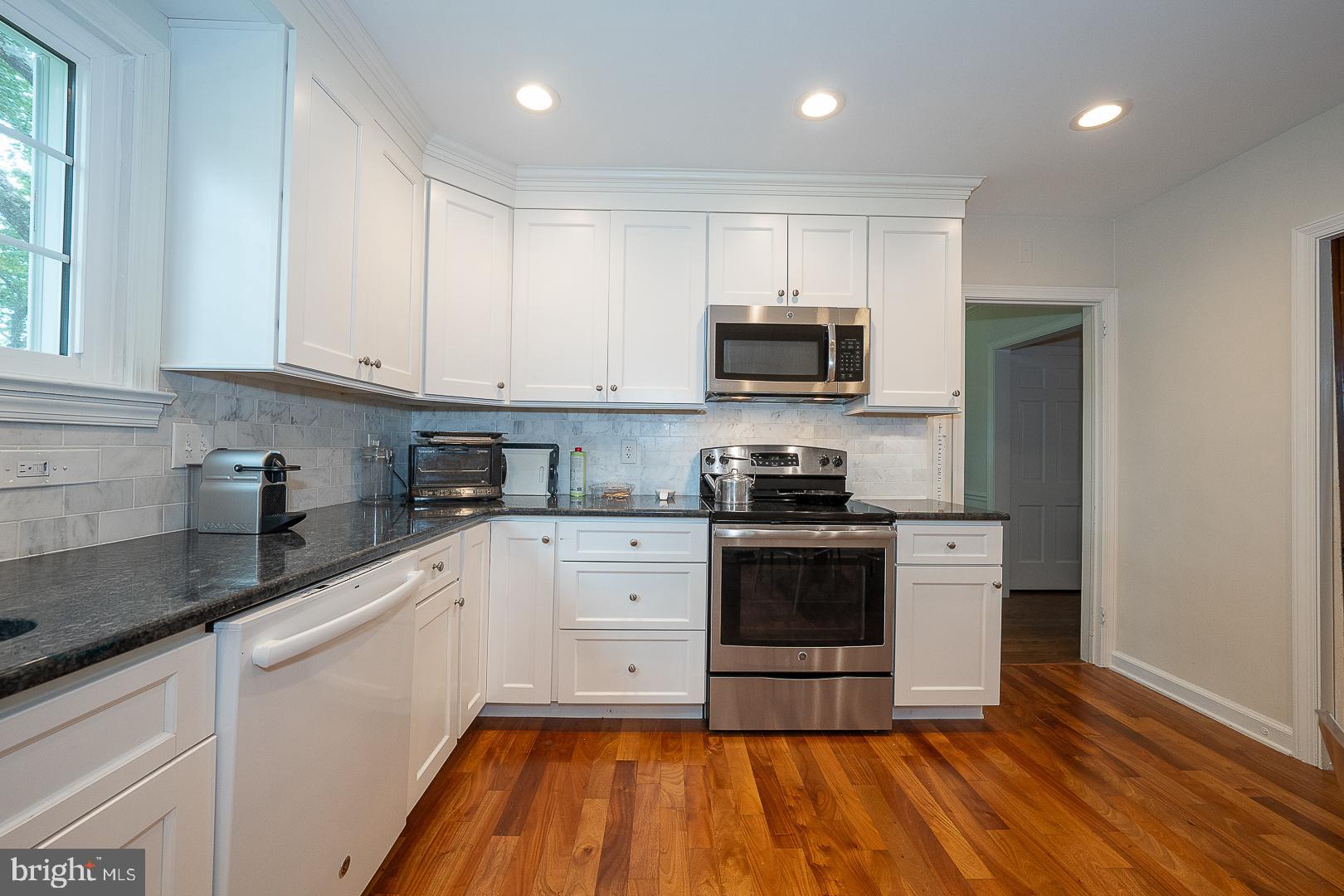 538 Conestoga Road Villanova, PA 19085 - Photo 11 of 39 a kitchen with stainless steel appliances granite countertop a stove a sink and a microwave
