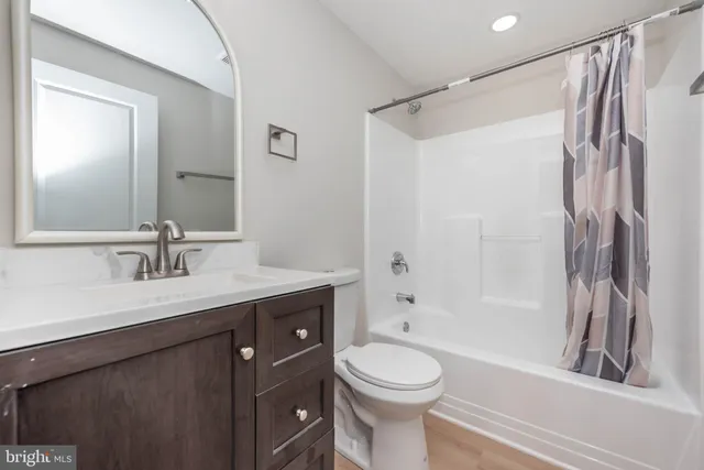a bathroom with a sink a toilet and a bathtub