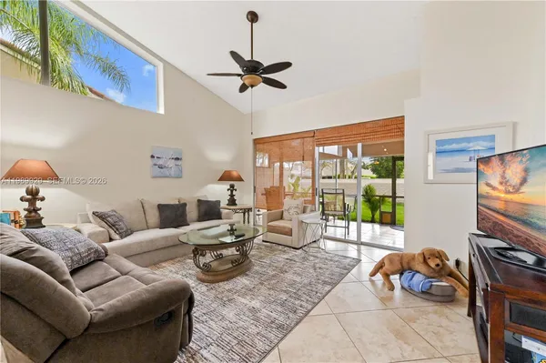 a living room with furniture and a flat screen tv
