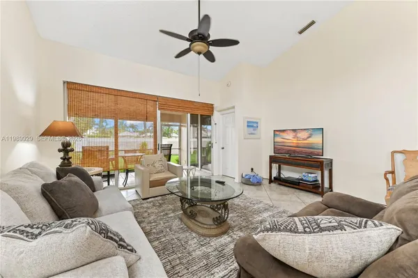 a living room with furniture fireplace and a flat screen tv
