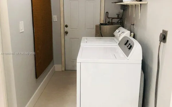 a utility room with dryer and washer