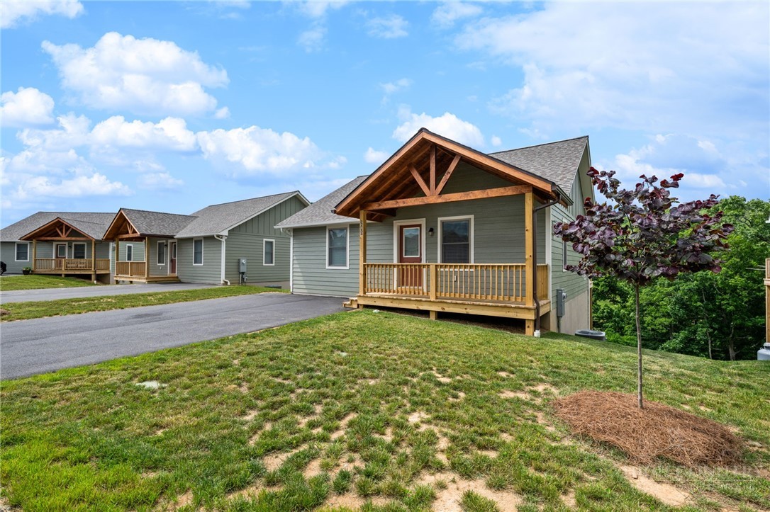 245 Ava Way, Unit 108 Boone, NC 28607 - Photo 3 of 31 a front view of a house with a yard