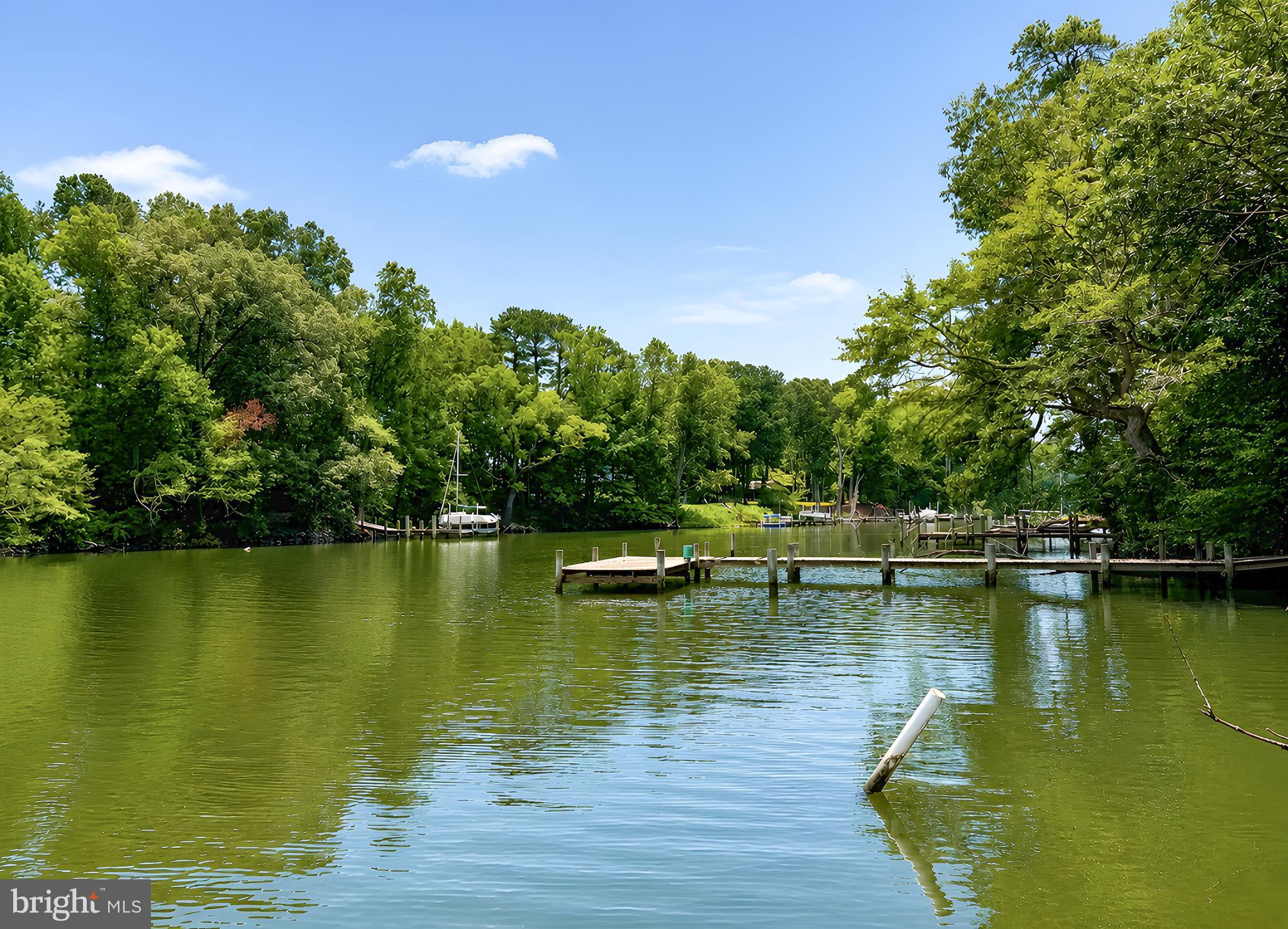 17248 Gum Landing Road St. Inigoes, MD 20684 - Photo 41 of 56 a view of a lake with houses in the background