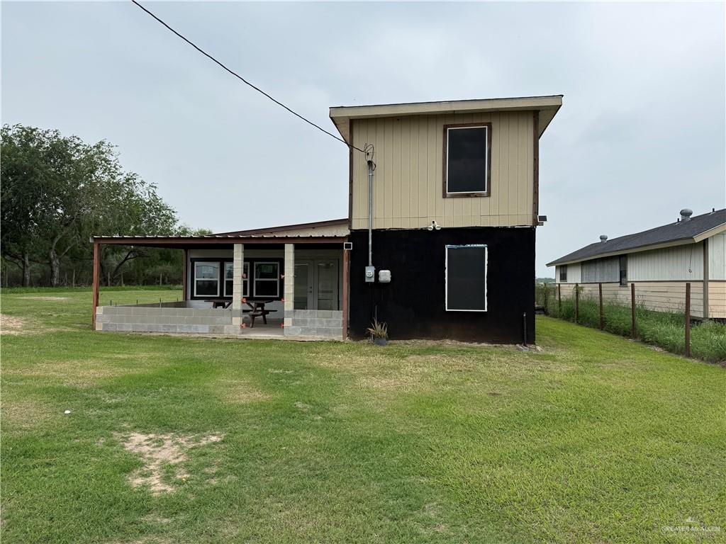 23265 Skinner Road Edcouch, TX 78538 - Photo 1 of 24 Two-story residence featuring a covered patio with concrete block foundation and structural columns