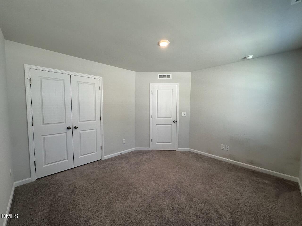 2521 Laurel Valley Way Raleigh, NC 27604 - Photo 5 of 25 a view of an empty room and closet area