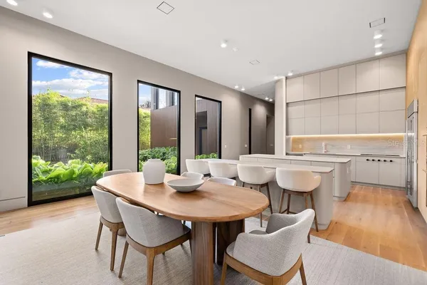 a view of a dining room with furniture and wooden floor
