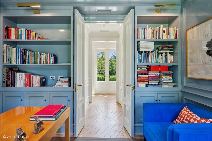 40 Woodley Road Winnetka, IL 60093 - Photo 11 of 60 a living room with furniture and a book shelf