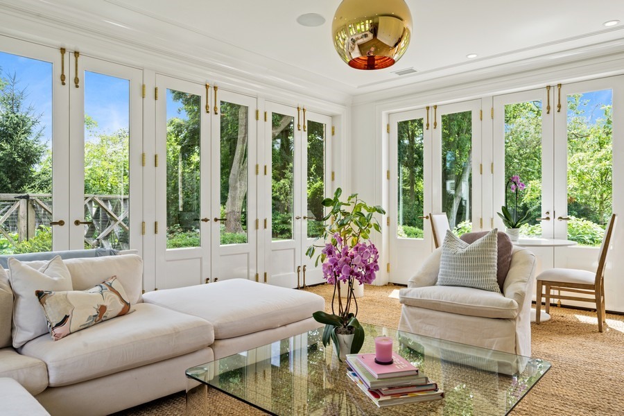 40 Woodley Road Winnetka, IL 60093 - Photo 15 of 60 a living room with furniture and a large window