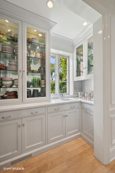 40 Woodley Road Winnetka, IL 60093 - Photo 24 of 60 a spacious bathroom with a granite countertop sink and a large mirror