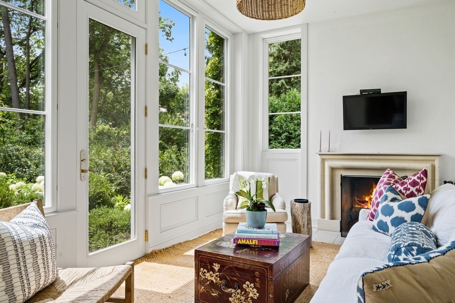 40 Woodley Road Winnetka, IL 60093 - Photo 27 of 60 a living room with furniture and a fireplace
