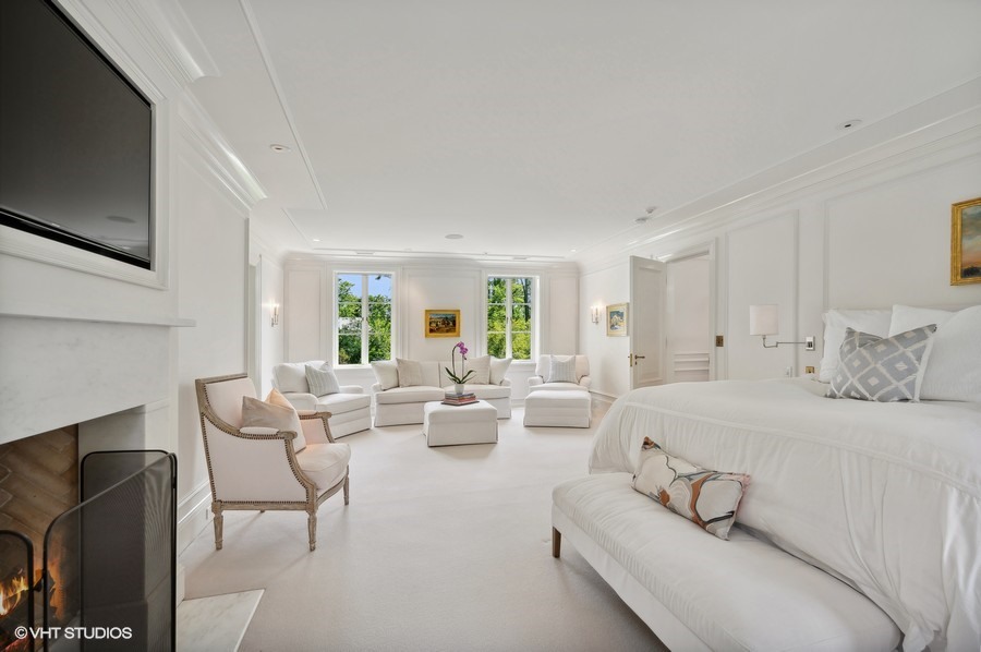 40 Woodley Road Winnetka, IL 60093 - Photo 36 of 60 a living room with furniture fireplace and a flat screen tv