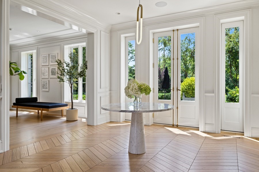 40 Woodley Road Winnetka, IL 60093 - Photo 4 of 60 a living room with furniture and large windows