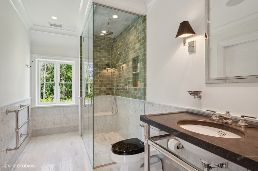 40 Woodley Road Winnetka, IL 60093 - Photo 42 of 60 a bathroom with a sink a toilet and shower