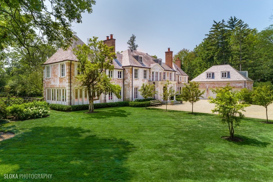 40 Woodley Road Winnetka, IL 60093 - Photo 52 of 60 a front view of a house with a yard