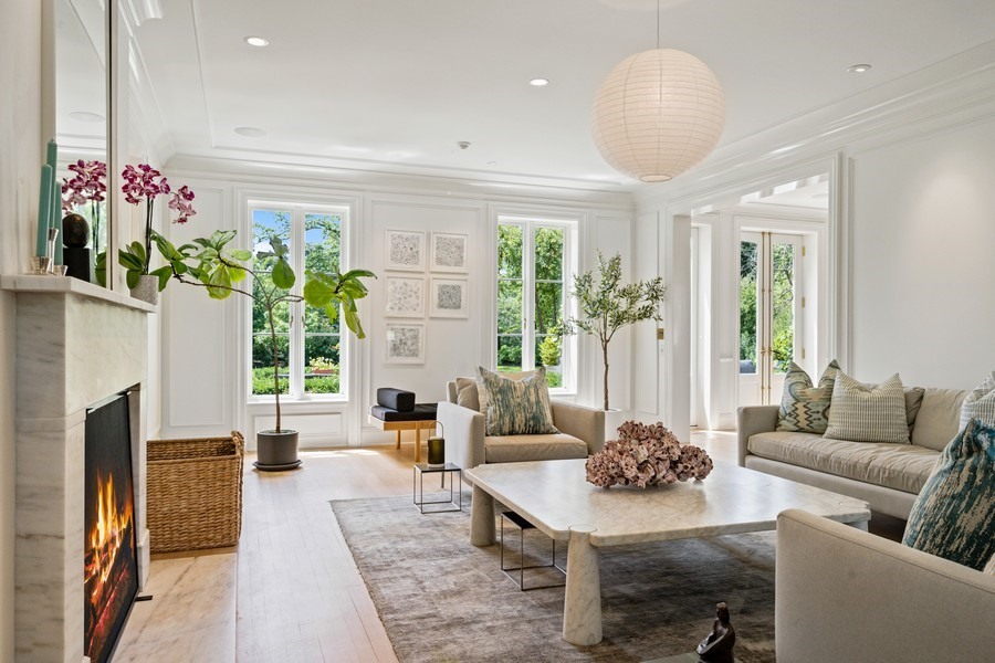 40 Woodley Road Winnetka, IL 60093 - Photo 7 of 60 a living room with furniture potted plant and a large window