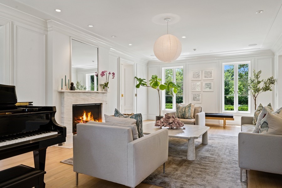 40 Woodley Road Winnetka, IL 60093 - Photo 8 of 60 a living room with furniture and a fireplace