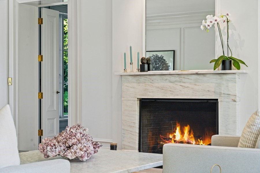 40 Woodley Road Winnetka, IL 60093 - Photo 9 of 60 a living room with furniture and a fireplace