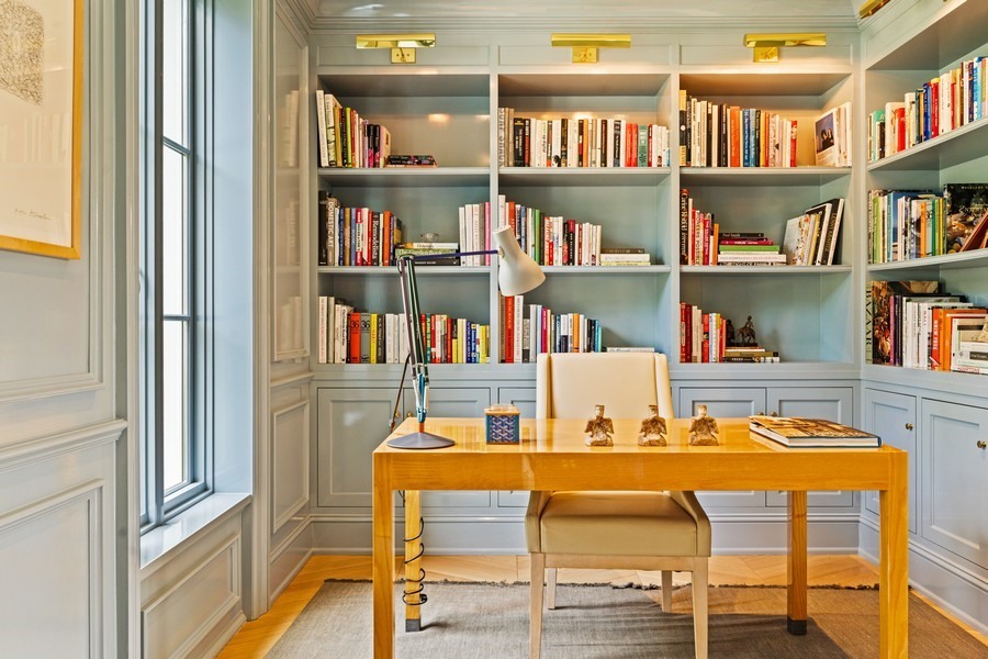 40 Woodley Road Winnetka, IL 60093 - Photo 10 of 60 a dining room with furniture and a book shelf