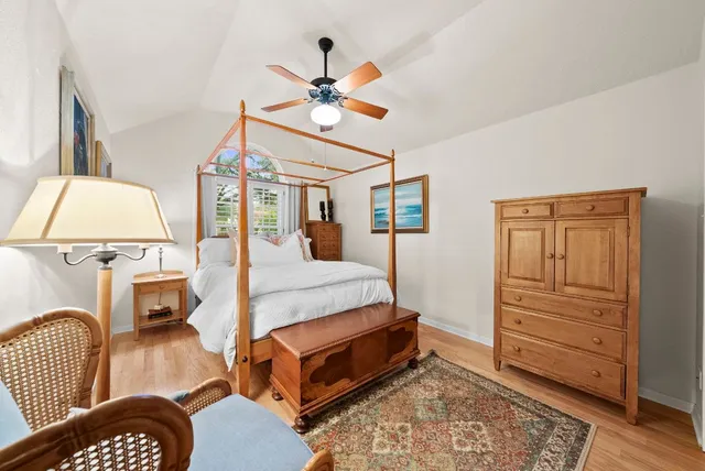 a bedroom with a bed and a chair