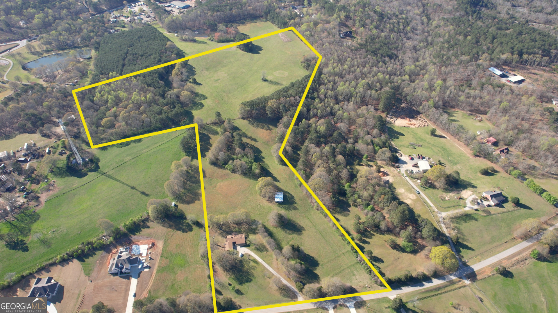 610 Loth Wages Road Dacula, GA 30019 - Photo 2 of 48 an aerial view of a tennis ground and large trees