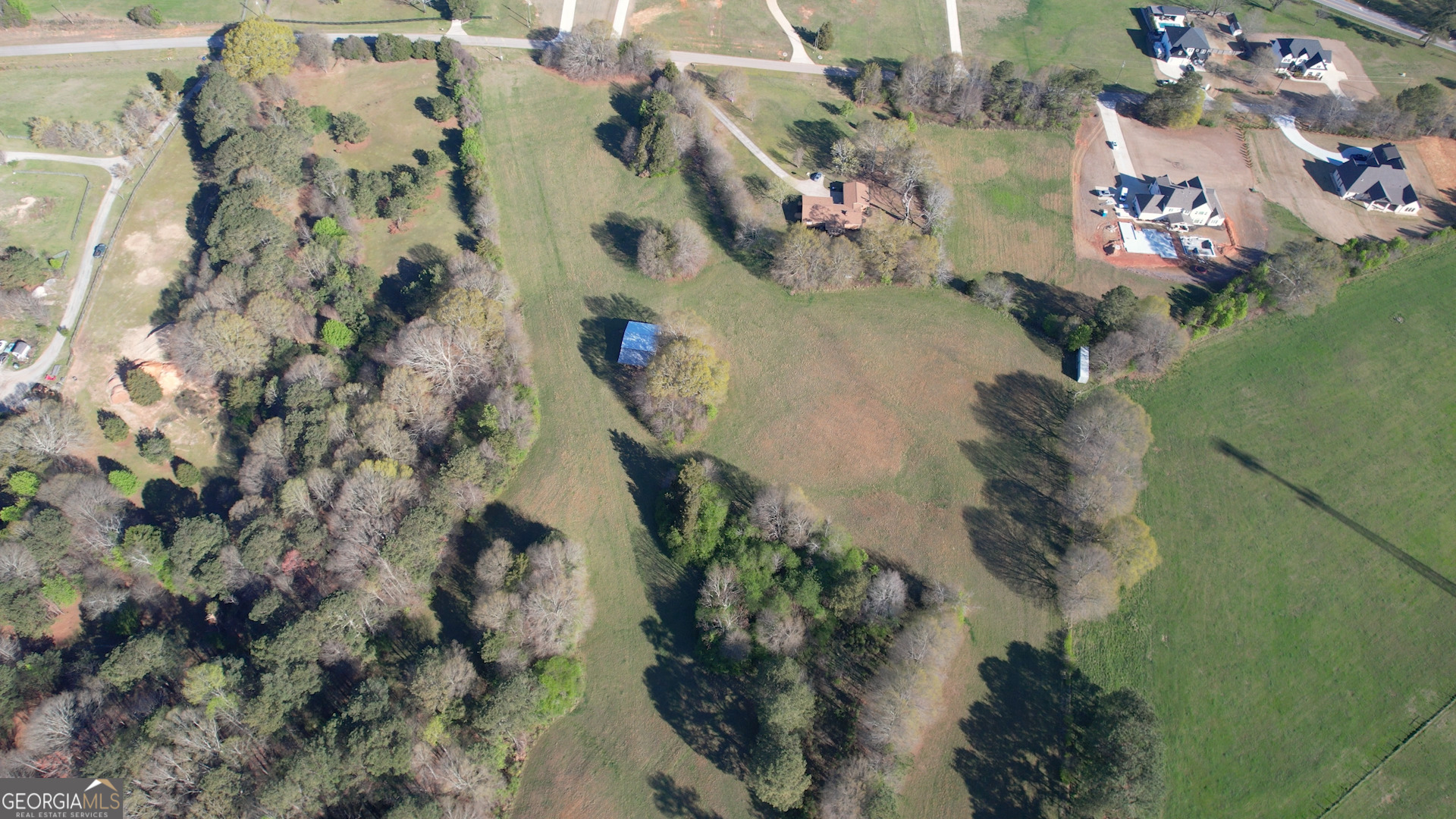 610 Loth Wages Road Dacula, GA 30019 - Photo 33 of 48 an aerial view of a house with a yard