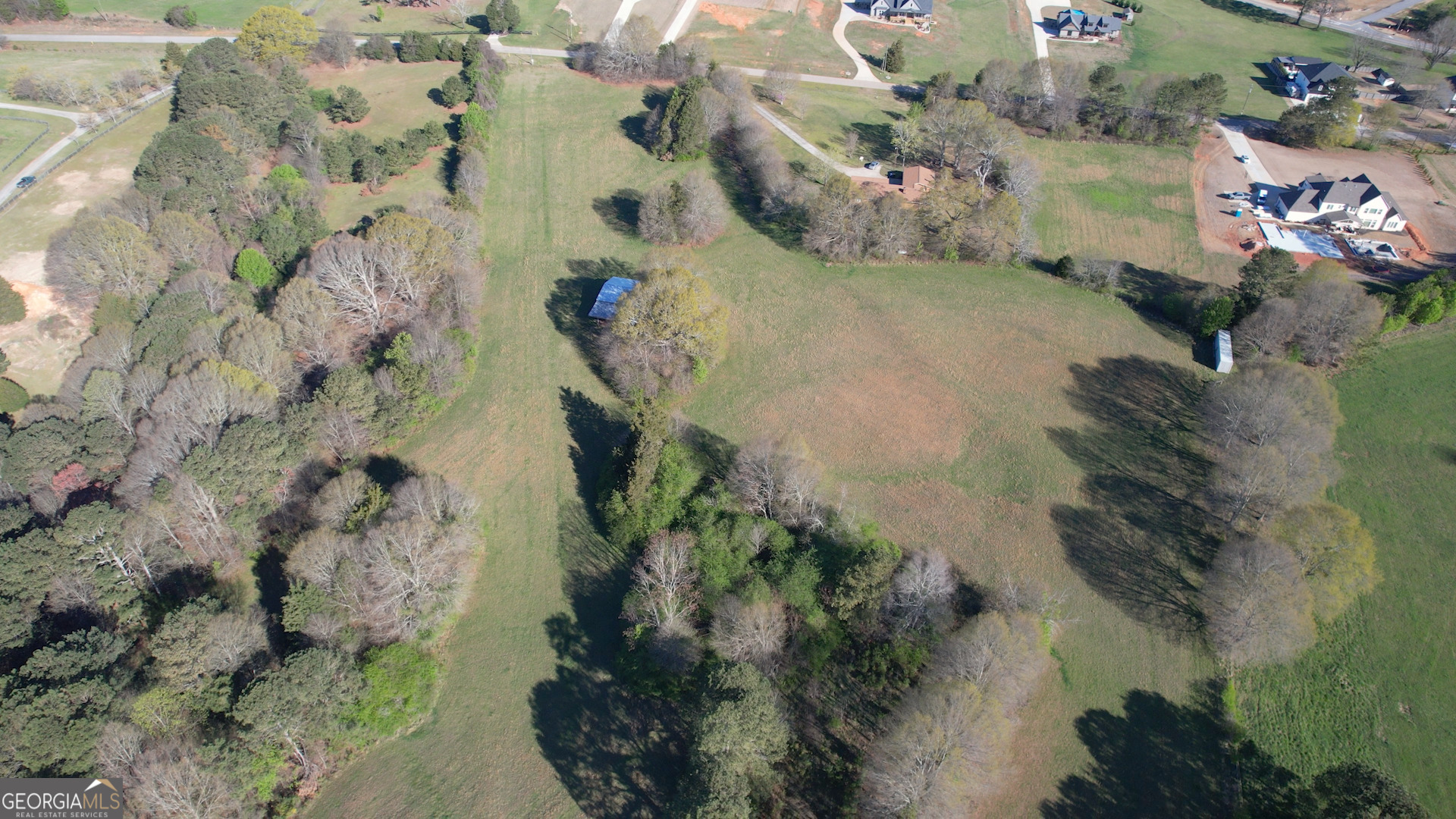 610 Loth Wages Road Dacula, GA 30019 - Photo 34 of 48 an aerial view of a house with a yard