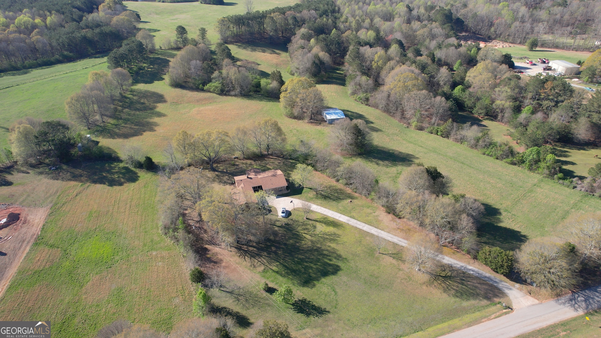 610 Loth Wages Road Dacula, GA 30019 - Photo 42 of 48 an aerial view of a house with a yard