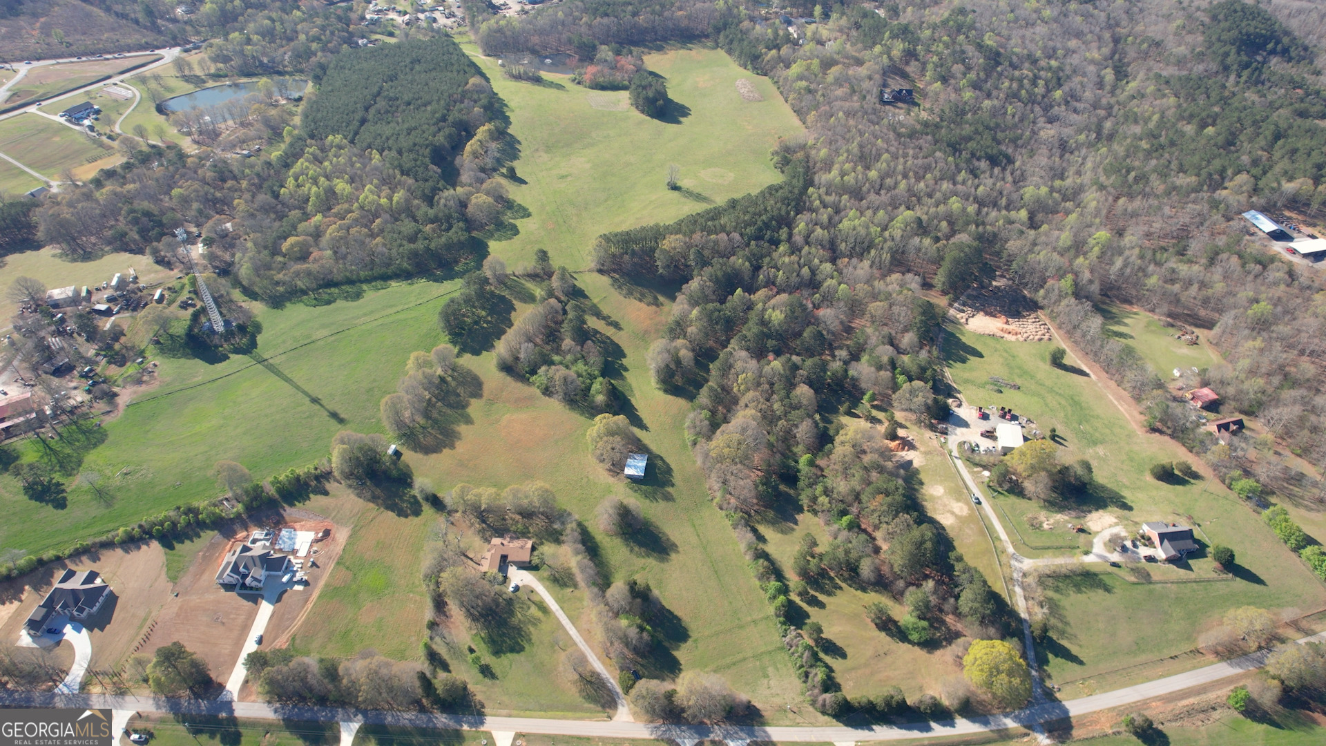 610 Loth Wages Road Dacula, GA 30019 - Photo 45 of 48 an aerial view of a house with a yard and large trees