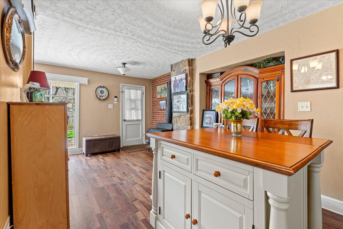 779 Catawba Road Daleville, VA 24083 - Photo 12 of 56 a room with stainless steel appliances a chandelier and a dining table