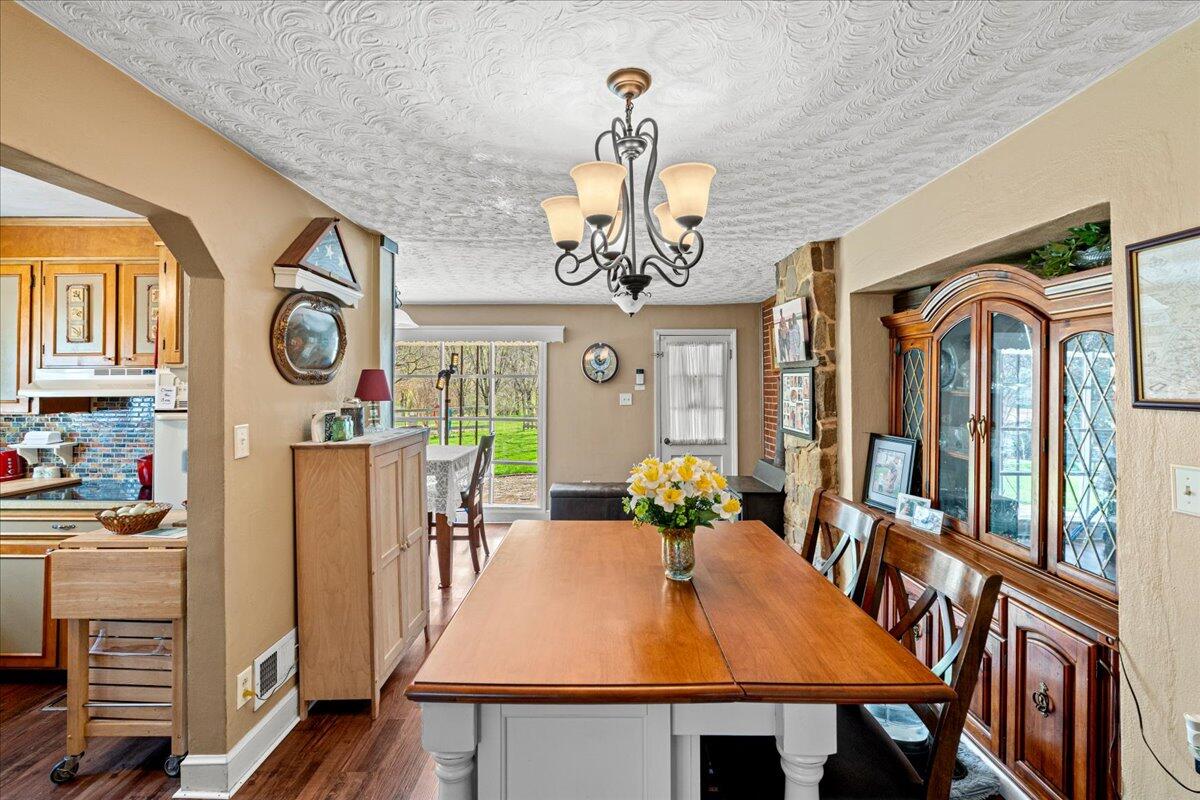 779 Catawba Road Daleville, VA 24083 - Photo 13 of 56 a view of a dining room with furniture wooden floor and chandelier