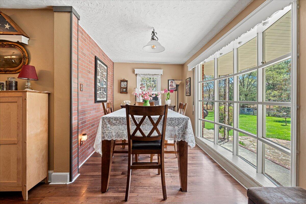 779 Catawba Road Daleville, VA 24083 - Photo 14 of 56 a view of a dining room with furniture window and wooden floor