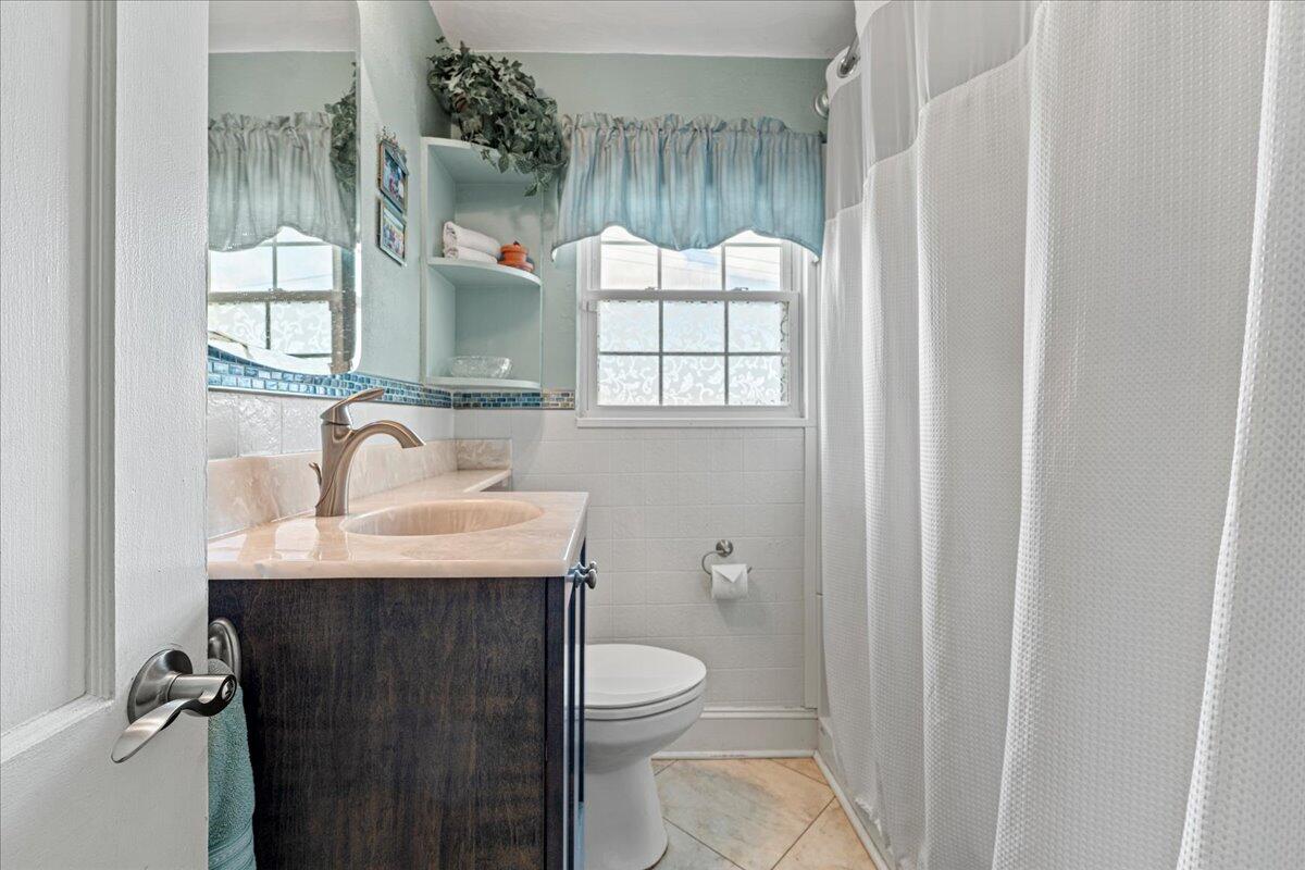 779 Catawba Road Daleville, VA 24083 - Photo 19 of 56 a bathroom with a sink a toilet and a mirror