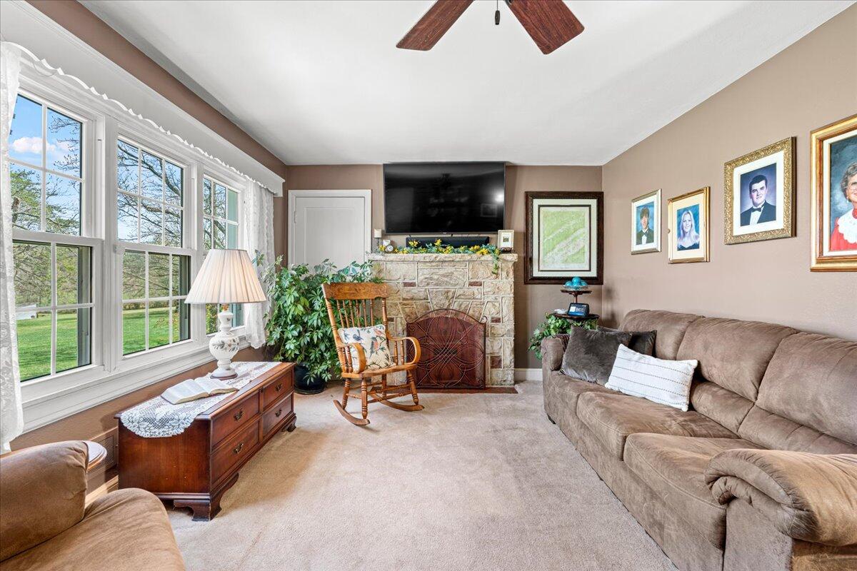 779 Catawba Road Daleville, VA 24083 - Photo 6 of 56 a living room with furniture a flat screen tv and a large window