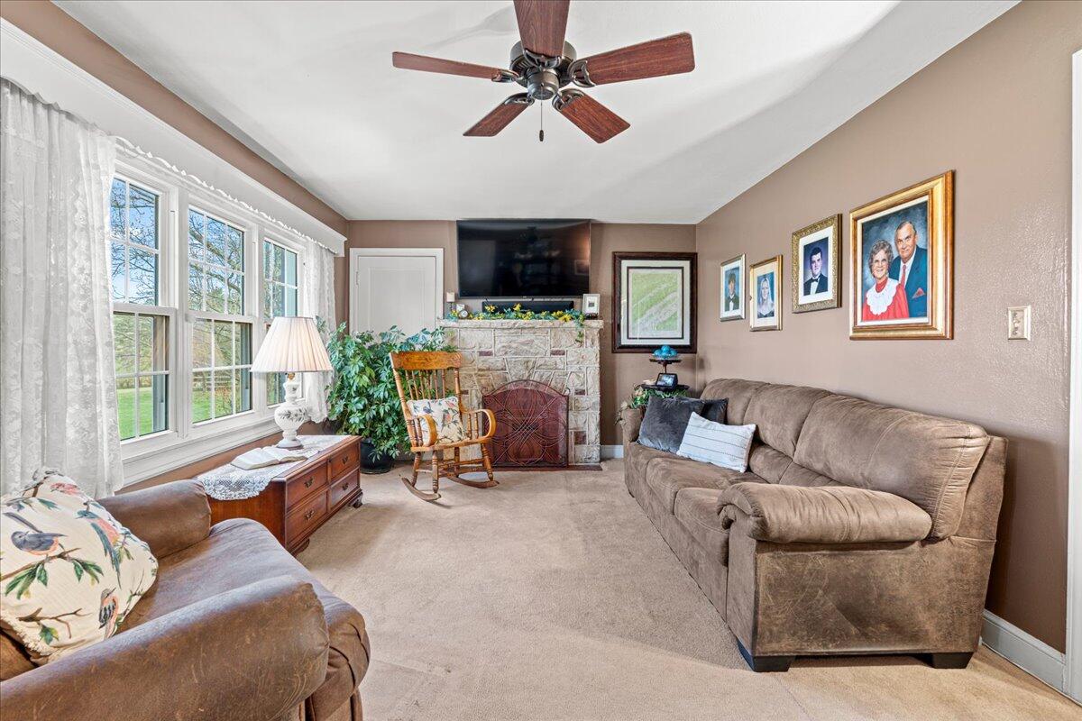 779 Catawba Road Daleville, VA 24083 - Photo 7 of 56 a living room with furniture a flat screen tv and a fireplace